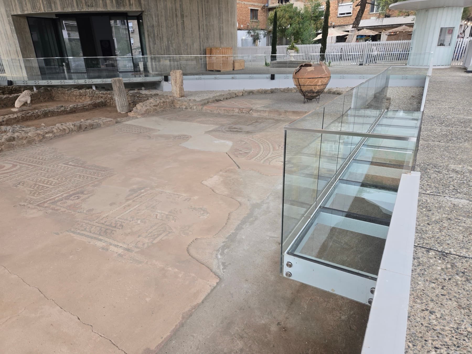 Mosaic floor with amphora seen from above.